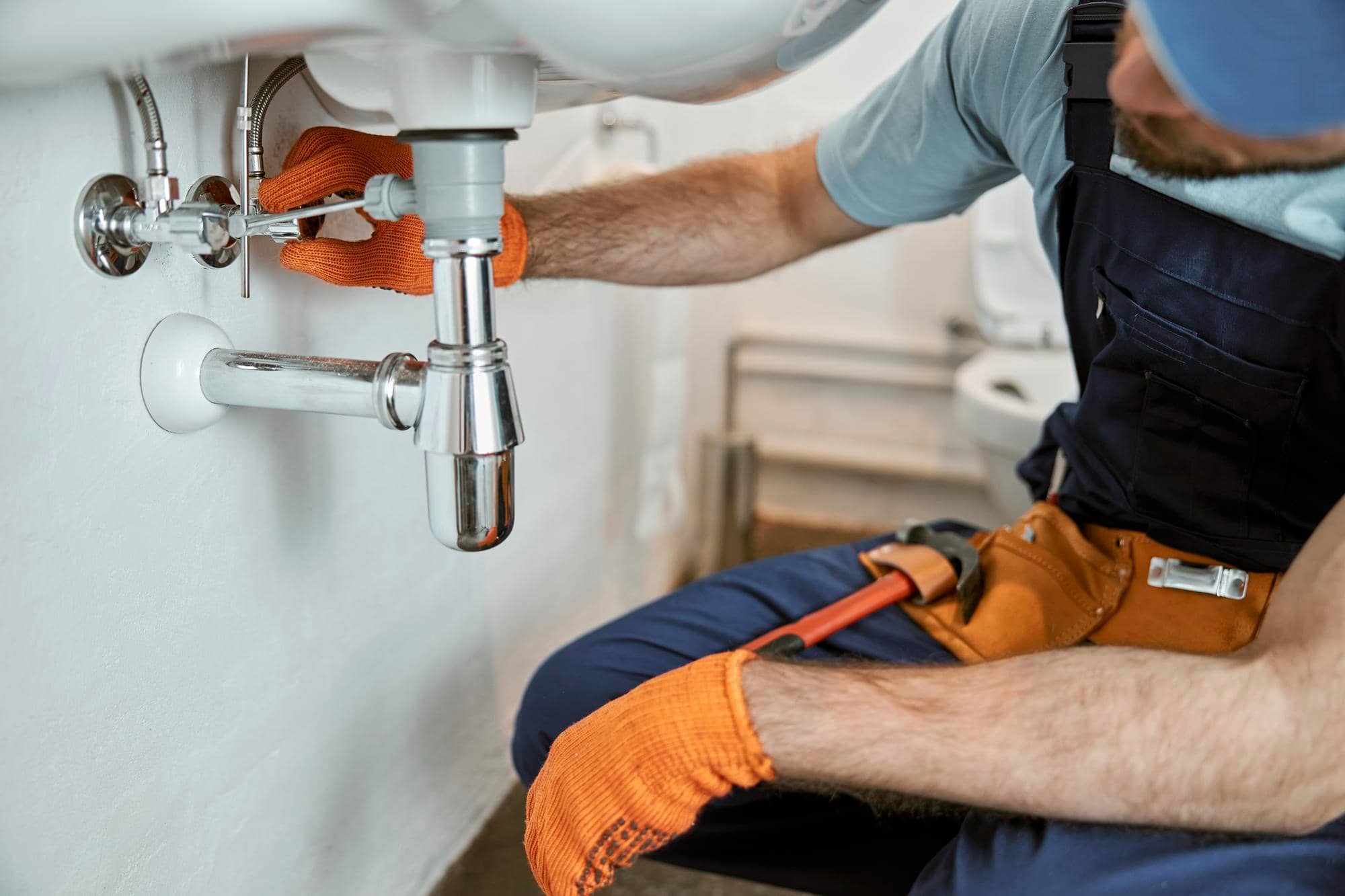 plumber working on a leak